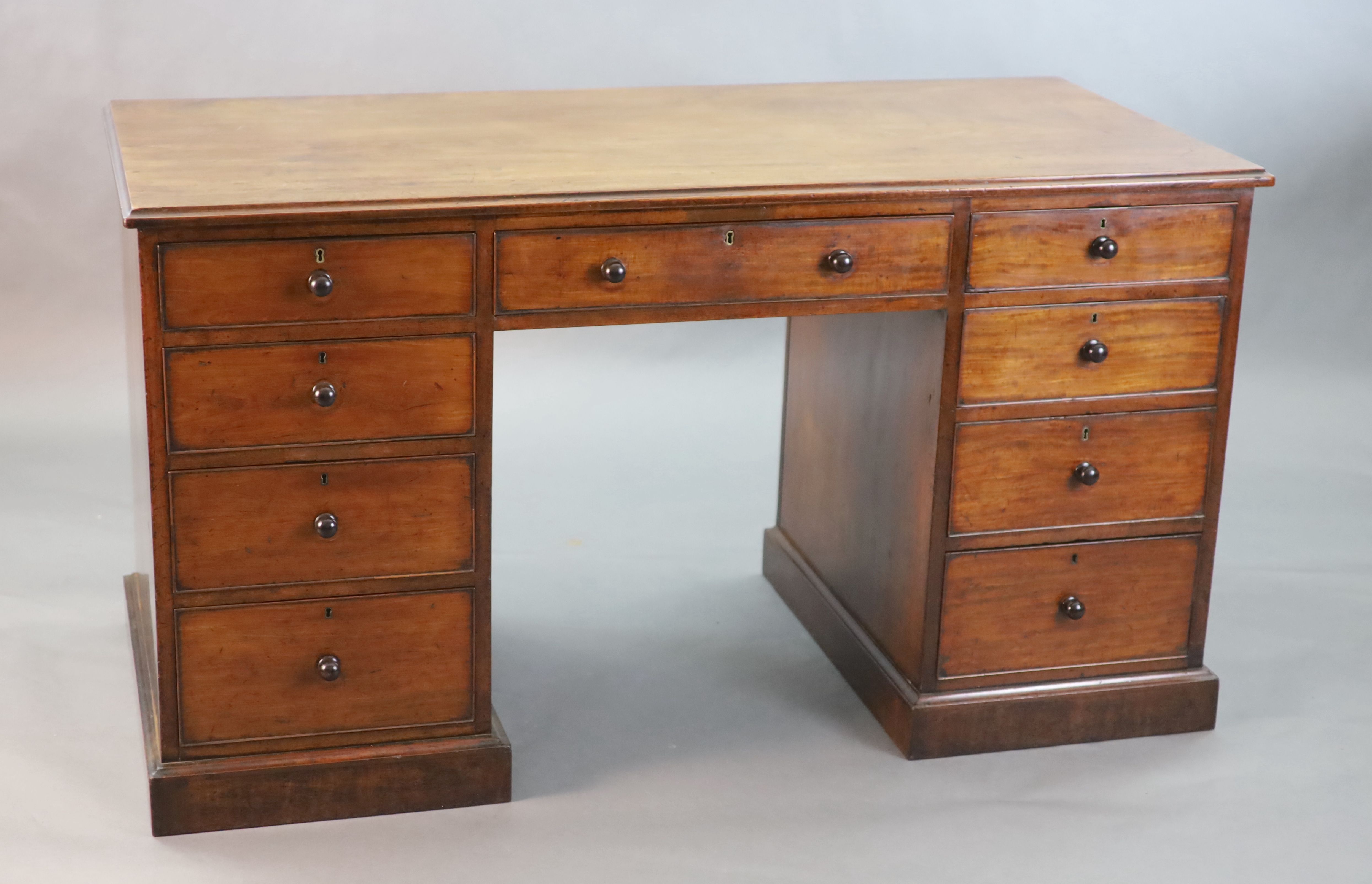 A George III mahogany kneehole desk, W.4ft 8in. D.2ft 2in. H.2ft 7in.